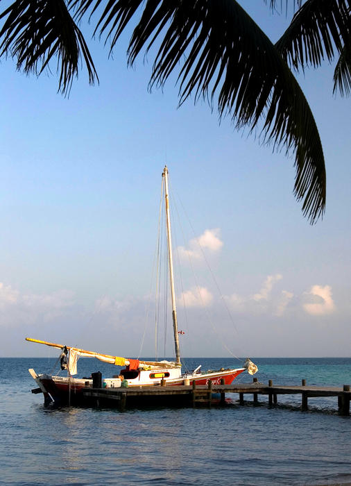 A boat moored in the beautiful blue caribbean sea, Belize